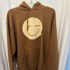 sadie crowell brown sweatshirt with yellow smiley face merch